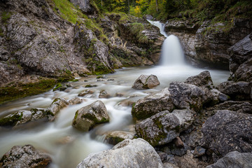 kuhflucht waterfall in forest long exposure alps germany