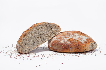 healthy homemade bread cut in half on white background.