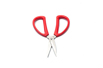 red scissors on a white background