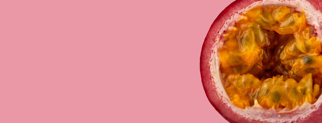 Passion fruit on a pink background, close-up, isolated, top view
