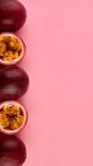 Passion fruit on a pink background, close-up, isolated, top view