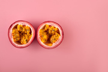 Passion fruit on a pink background, close-up, isolated, top view