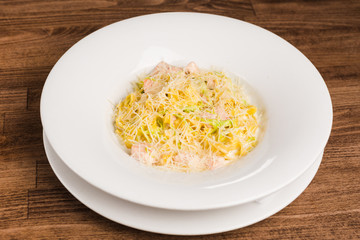 fresh homemade pasta with white sauce and cheese