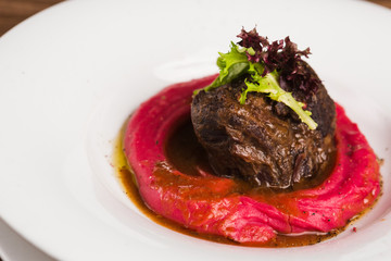 beef steak with red puree and ju sauce