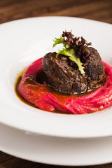 beef steak with red puree and ju sauce