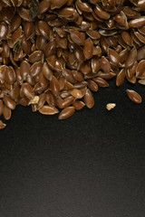 Brown Flax seed. Also known as Linseed, Flaxseed and Common Flax. Closeup of grains, background use.