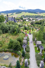 Tylicz, Poland. 2019/8/8. The way of the Cross and the Sanctuary of Our Lady of Tylicz as seen from...