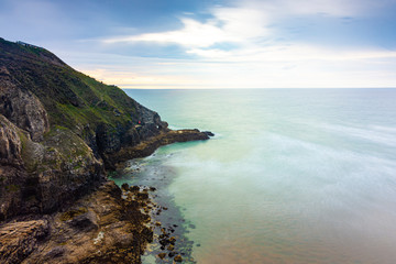 Fototapeta na wymiar Dramatic Cliffs and Coastline - Perranporth, Cornwall, UK