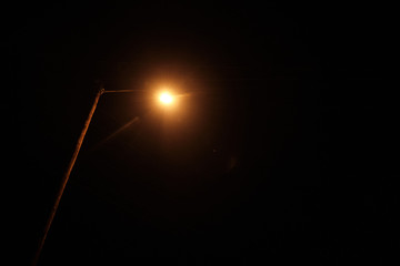 A street light at night. 