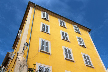 Fototapeta na wymiar old french yellow restored building in Hyères