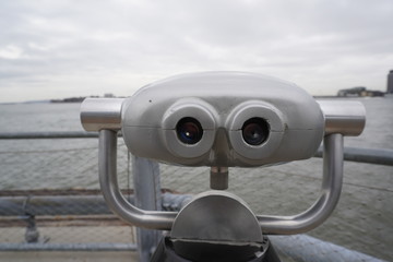 coin operated binoculars on the beach