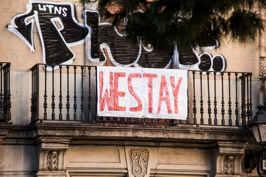 Residential building is occupied by unauthorized squatters and transformed into illegal squat. Anarchist hand-written banner from the window.