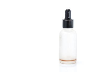 Empty transparent vape liquid bottle with residue isolated on the white background