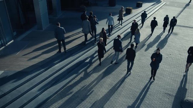 Office Managers and Business People Commute to Work in the Morning or from Office on a Sunny Day on Foot. Pedestrians are Dressed Smartly. Successful People Walking in Downtown. Footage from Above.