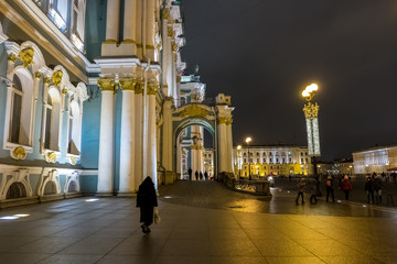 View of the Winter Palace and Palace Square in St. Petersburg. Night shot Beautiful panorama with night lights. Reflection of holiday lights. Christmas Eve.