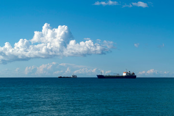 Sky, sea and ships on horizon