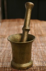 Old mortar made of metal for grinding products into manual