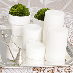 Home decoration; white candles decoration.