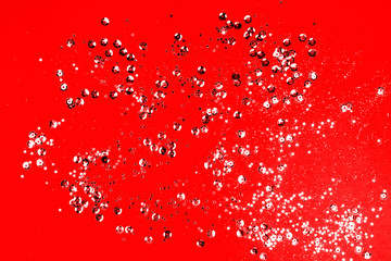 Red Christmas texture. red glitter texture valentine's day background with gold and silver sparkles.