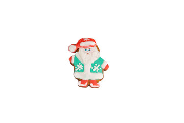 Obraz na płótnie Canvas Traditional bright colorful Christmas ginger ice cookies are shaped like Santa Claus and isolated on a white background.