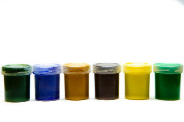 Gouache paints for drawing. Paints for painting in banks. Paints for the artist in a row, in a bunch, in macro. Art.