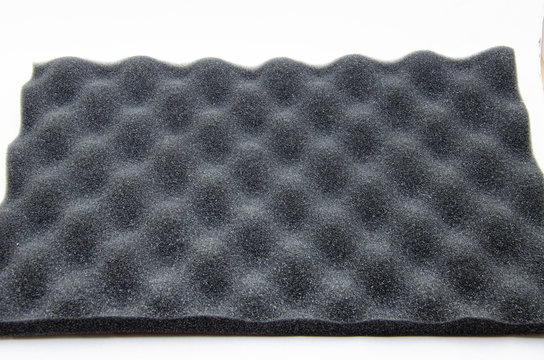 Foam rubber. Professional soundproofing for audio and video recording studios. Soundproof paralon on a white background, in macro. Soundproofing texture background for studio