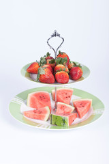 Fruit bowl centerpiece;  photo on wooden background.