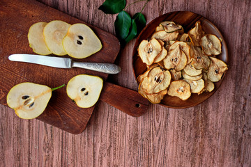 Cinnamon pear chips with fresh pears . Space for text.  Healthy snack. Homemade pear chips. Organic...
