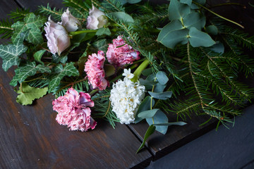 Close-up on the florist's table are flowers to form a bouquet to order, the concept of your own floristic salon