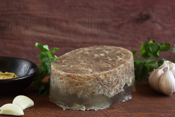  Home jelly is on the kitchen Board. Aspic with mustard, garlic,Bay leaf, decorated with parsley....