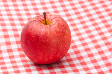 Red apple on table napkin