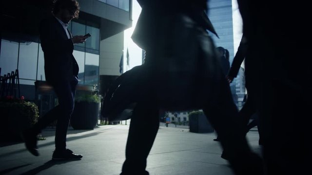 Office Managers and Business People Commute to Work in the Morning or from Office on a Sunny Day on Foot. Pedestrians are Dressed Smartly. Successful People Holding Smartphones. Footage from Above.