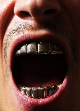 Scream. Aggression man with gold teeth. People and aggression concept close up. Emotional angrily screams.