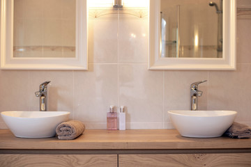 Naklejka na ściany i meble Modern bathroom with two sinks new luxury design with two mirrors close-up