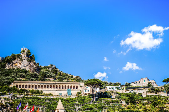 Amalfi city panoramic view cityscape on torre dello ziro, mountain rock cliff and blue sky.