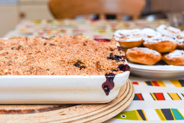 Freshly baked home made fruit crumble with ingredients fresh from the oven