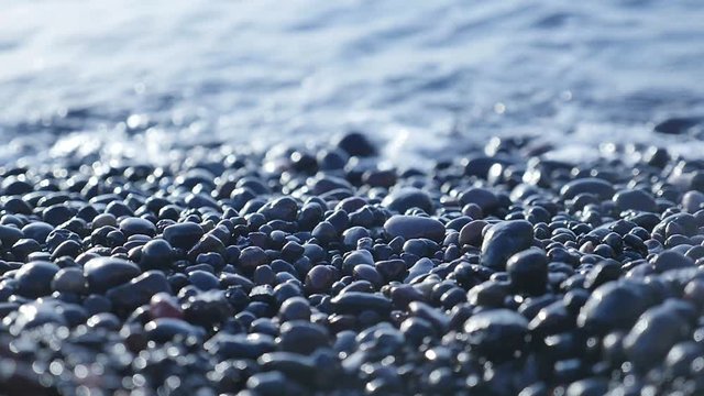  black beach pebble waves sea