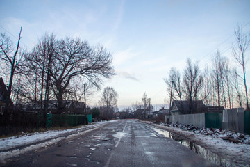 Obraz premium Driving through some small village in Russia in winter