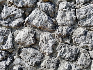 Rock wall background. Grey. Detail.