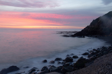 Oamaru, New Zealand. Cape Wanbrow Track to Second Beach. Sunrise over the bay.