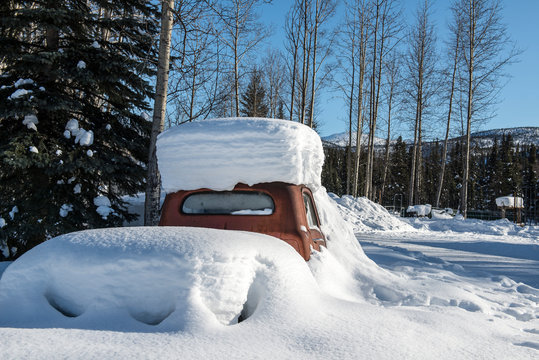 Red Truck Buried In Snow