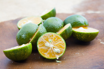 Freash of calamansi cut on wood background