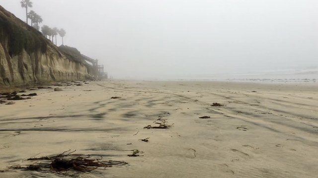 4K Foggy beach. View on Encinitas Bluff beach in California.
