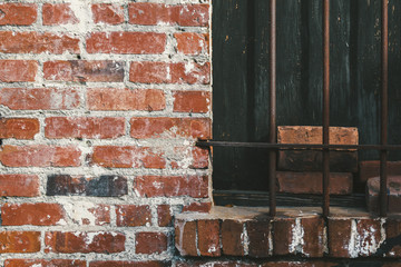 Grunge brick wall metal burglar bars background texture