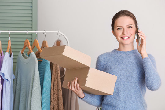 Female owner of online shopping site preparing order for client