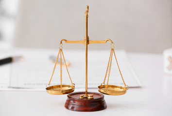 Scales of justice on lawyer's workplace