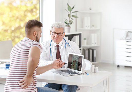 Young Man Visiting Urologist In Clinic