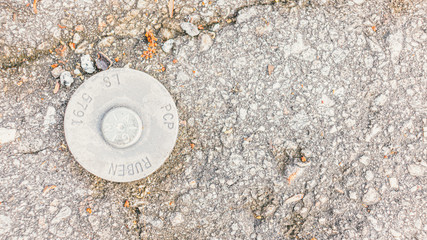 Bolt on grungy concrete background texture