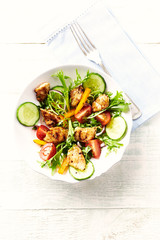 Healthy Salad with Grilled Chicken Briest, Cherry Tomatoes, Yellow Pepper, Cucumber and Endive. Bright wooden background. Top view. autor: Eugeniusz Dudziński - obrazy, fototapety, plakaty