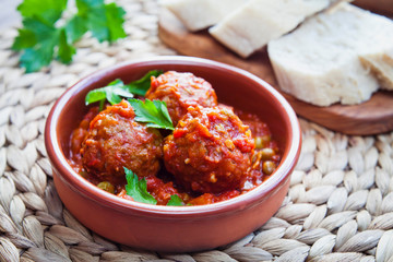 Albondigas - Spanish cuisine traditional homemade meatballs in rich tomato sauce.